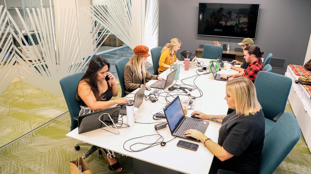 Employees work at Aya Healthcare on Thursday, Oct. 27, 2022 in San Diego, CA. (Eduardo Contreras / The San Diego Union-Tribune)