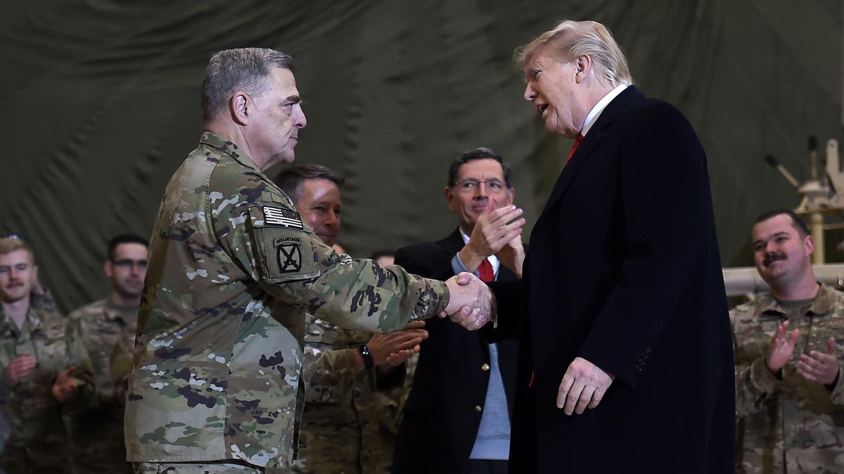Former President Donald Trump shakes hands with former Joint Chiefs Chairman General Mark Milley.