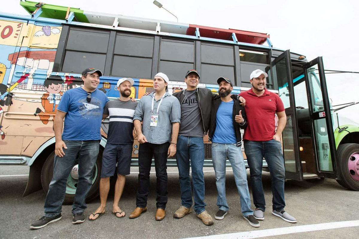 Julio Quezada, Mathieu Janelle, Daniel Garza, Eduardo Marin, Javier Amador and Daniel Galindo pose for a photo next to a bus painted by them, including parts painted in the colours of Mexico's flag - green, white and red, which they drove across Europe to follow their national team during the World Cup in Russia, in Yekaterinburg, Russia, June 28, 2018. Eduardo Marin/Handout via REUTERS