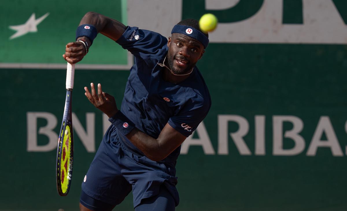 May 28, 2026; Paris, France; Frances Tiafoe of the United States serves the ball  during his match against Hubert Hurkacz of Poland on day five at Stade Roland Garros. Mandatory Credit: Susan Mullane-Imagn Images