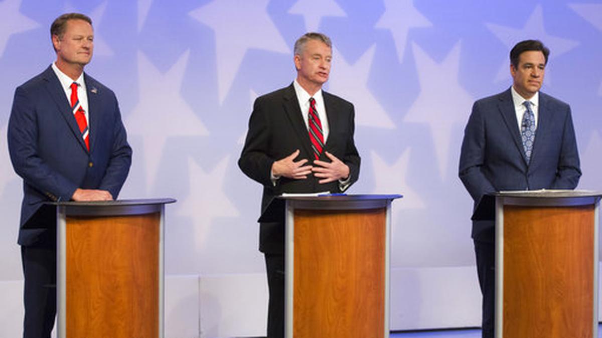 FILE - In this April 23, 2018, file photo, Republican Boise businessman Tommy Ahlquist, from left, Lt. Gov. Brad Little and Rep. Raul Labrador, R-Idaho, participate in a debate at the studios of Idaho Public Television in Boise, Idaho.