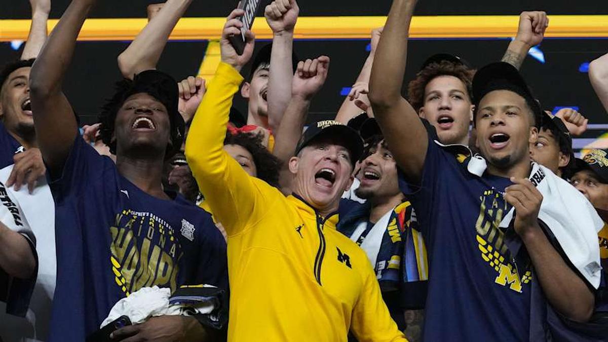  The Michigan Wolverines celebrate their NCAA men's basketball tournament national championship victory Monday, April 6, 2026, after defeating the UConn Huskies 69-63 at Lucas Oil Stadium in Indianapolis. | Christine Tannous/IndyStar / USA TODAY NETWORK via Imagn Images 