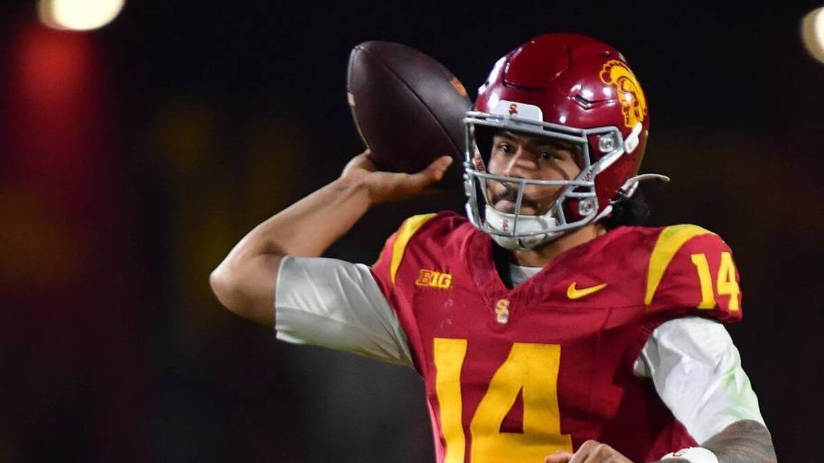  Nov 7, 2025; Los Angeles, California, USA; Southern California Trojans quarterback Jayden Maiava (14) throws against the Northwestern Wildcats during the second half at the Los Angeles Memorial Coliseum. Mandatory Credit: Gary A. Vasquez-Imagn Images | Gary A. Vasquez-Imagn Images 