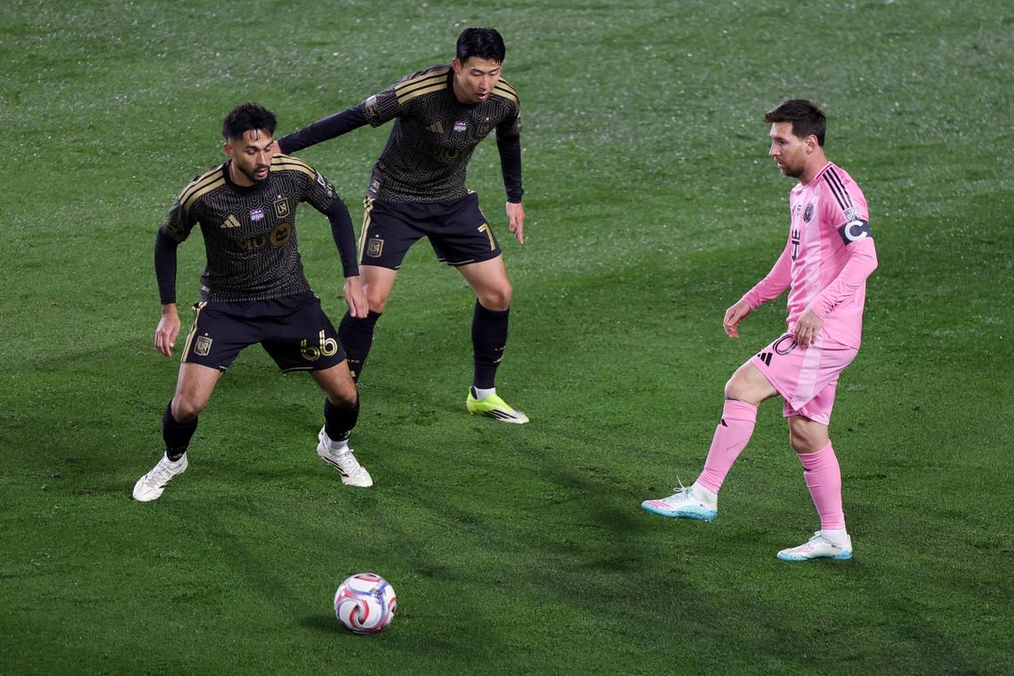  Lionel Messi passes the ball against Mathieu Choinière and Son Heung-Min during the MLS match between Los Angeles Football Club and Inter Miami CF. Photo by Ryan Sirius Sun/MLS via Getty Images