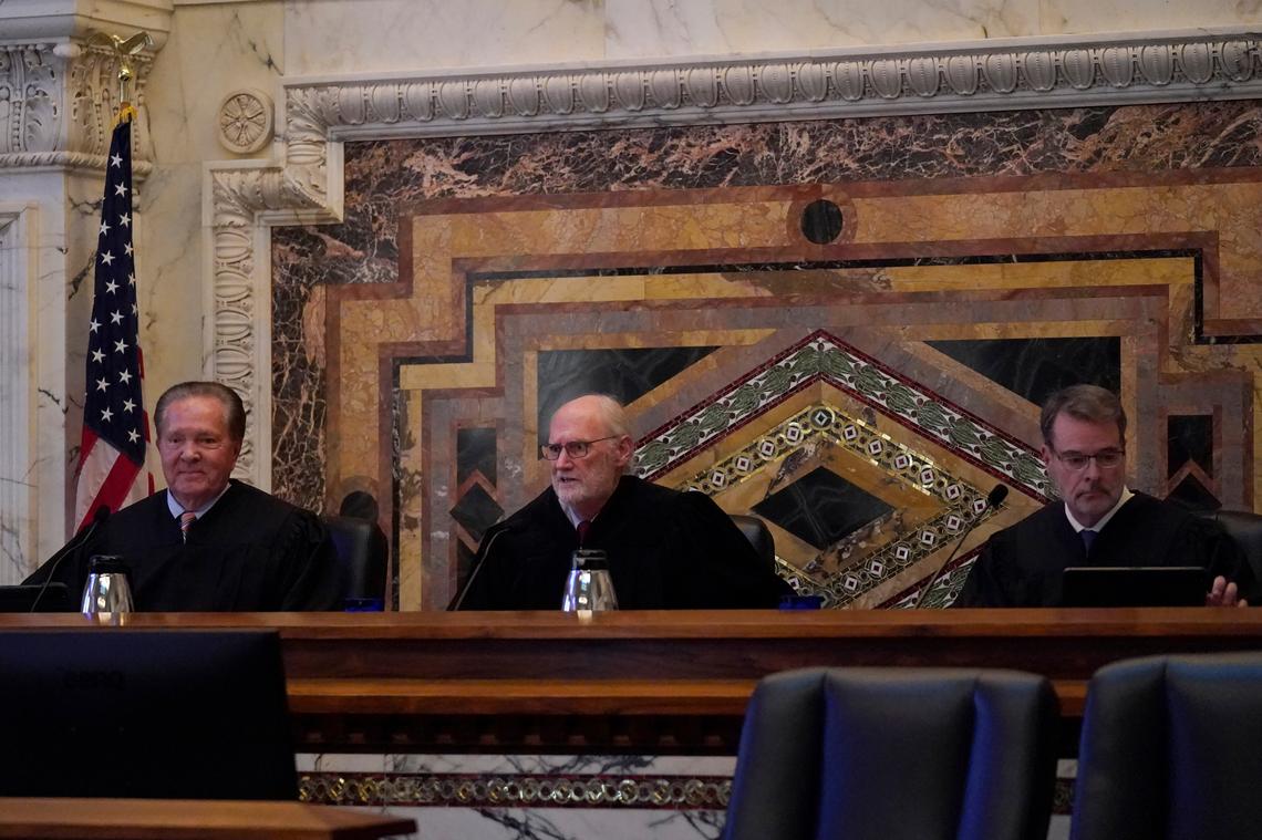 Judges Milan D. Smith Jr., from left, sits on a panel with Sidney R. Thomas and Michael J. McShane before hearing arguments at the Ninth Circuit Court of Appeals in San Francisco, Monday, Nov. 14, 2022. Apple is heading into a courtroom faceoff against Epic Games, the company behind the popular Fortnite video game, reviving a high-stakes antitrust battle over whether the digital fortress shielding the iPhone’s app store illegally enriches the world’s most valuable company while stifling competition.
