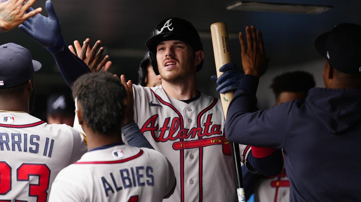Catcher Jonah Heim, center, had a career day for the Atlanta Braves, driving in five runs in a 11-6 rout of the Colorado Rockies at Coors Field on Sunday in Denver, Colo.