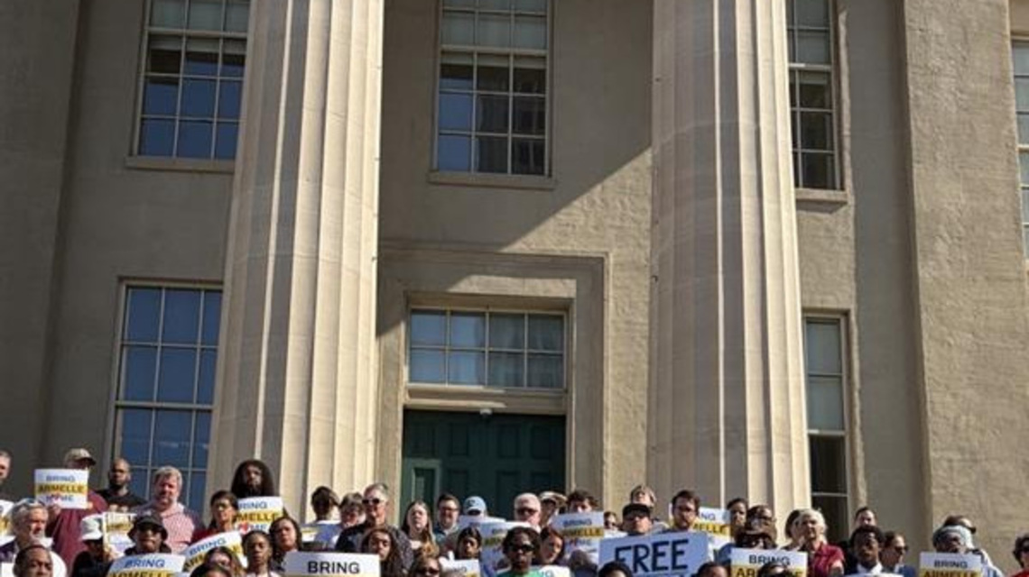 Supporters gather at Metro Hall to call for Armelle Bondonga's release 