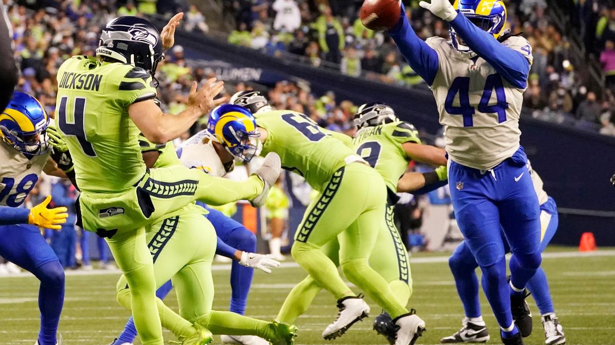 Los Angeles Rams linebacker Jamir Jones (44) blocks a kick by Seattle Seahawks punter Michael Dickson (4) during the second half of an NFL football game, Thursday, Oct. 7, 2021, in Seattle. (AP Photo/Elaine Thompson)