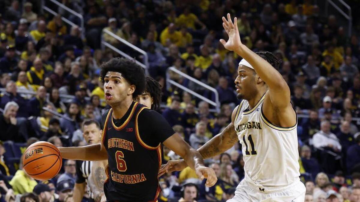  Jan 2, 2026; Ann Arbor, Michigan, USA; Southern California Trojans forward Jacob Cofie (6) dribbles on Michigan Wolverines guard Roddy Gayle Jr. (11) in the second half at Crisler Center. Mandatory Credit: Rick Osentoski-Imagn Images | Rick Osentoski-Imagn Images 