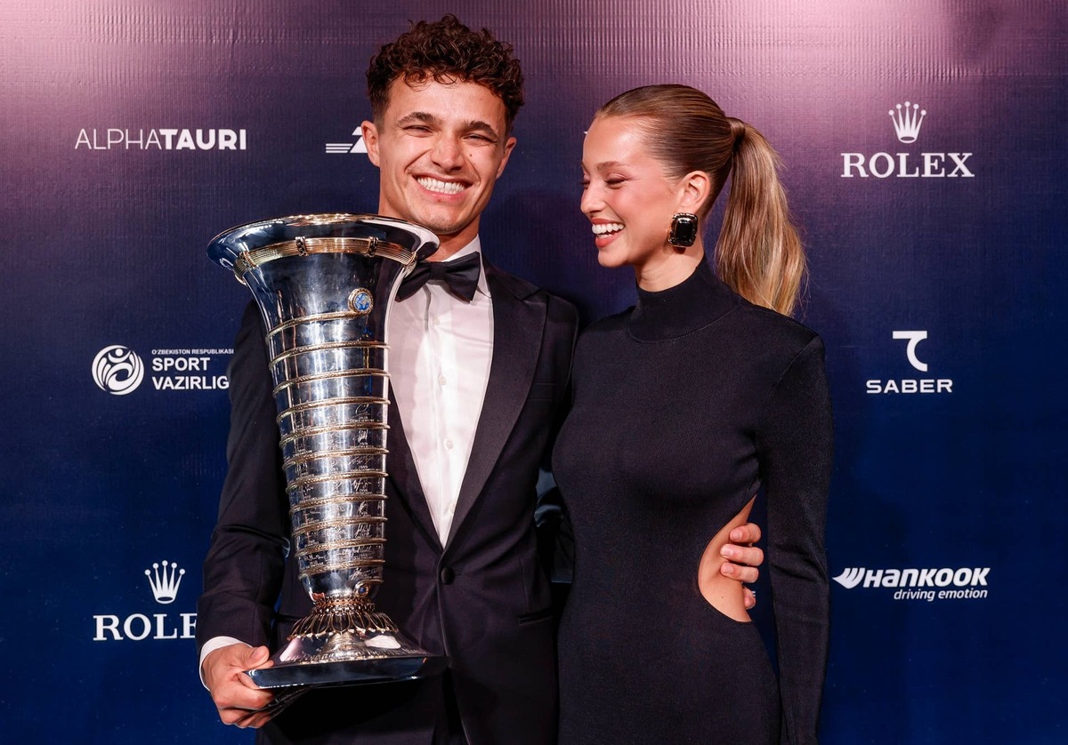  Lando Norris and Magui Corceiro pose with his Formula 1 Championship Trophy during the 2025 FIA Awards. Handout/FIA/DPPI via Getty Images