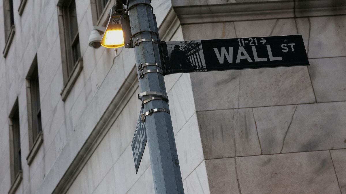 FILE PHOTO: The Wall street sign hangs outside the New York Stock Exchange (NYSE) building on Tuesday following Monday?s broad sell off in New York City, U.S., March 11, 2025. REUTERS/Shannon Stapleton/File Photo