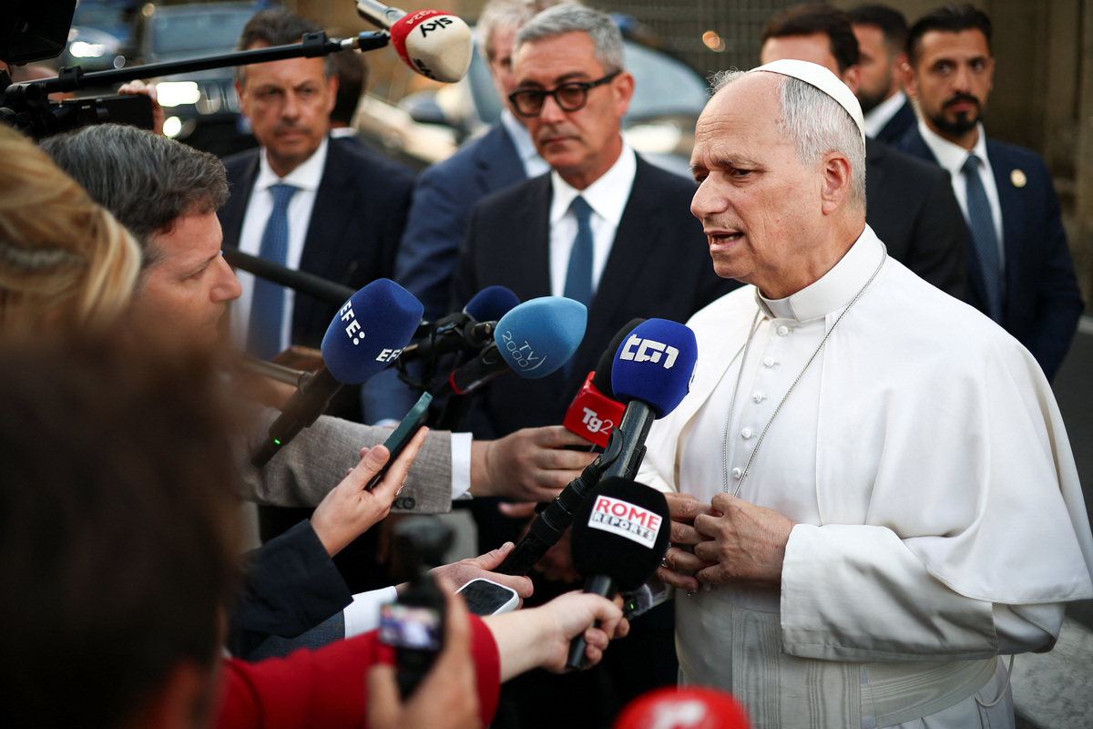 Pope Leo XIV speaks to journalists as he leaves the papal residence to head back to the Vatican, in Castel Gandolfo, Italy, June 16, 2026. REUTERS/Guglielmo Mangiapane