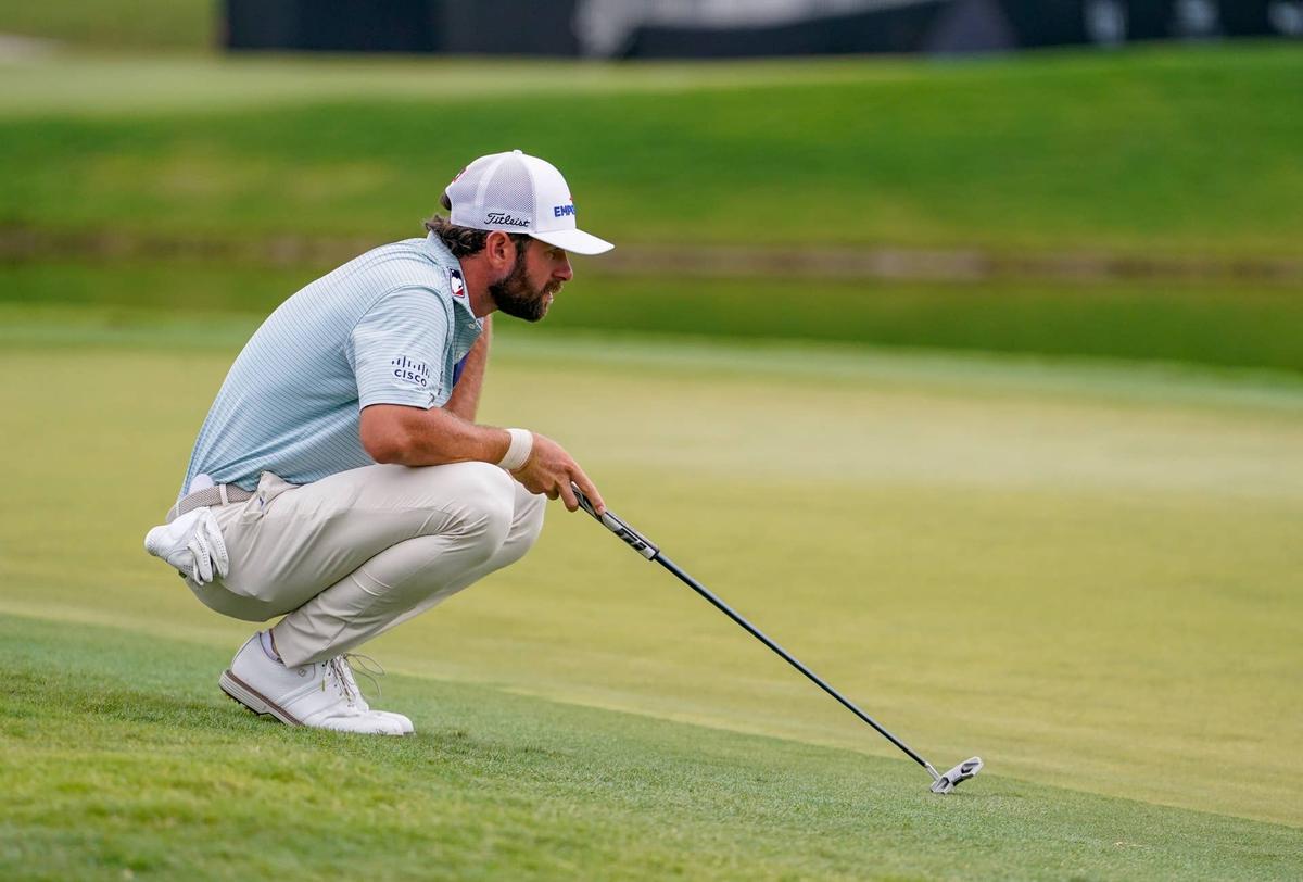  Cameron Young lines up his putt on the first hole during the final round of the Cadillac Championship. 