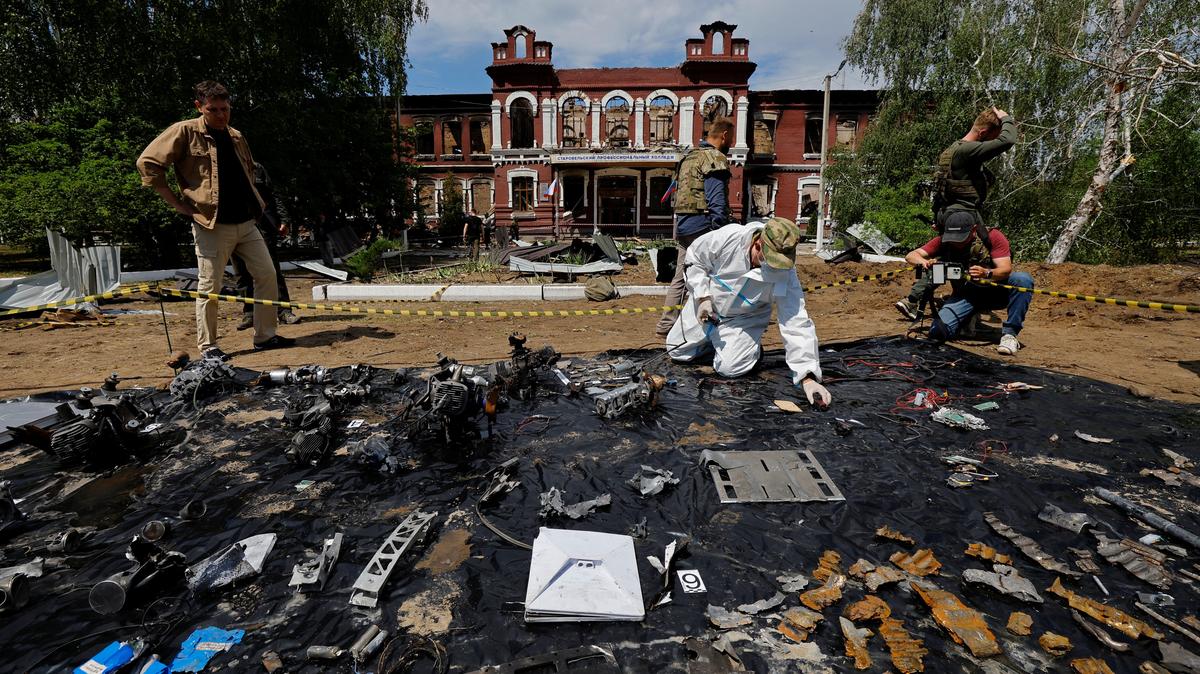 An investigator works in front of the destroyed building of the Starobilsk College of Luhansk Pedagogical University following a recent attack, which Russian authorities called a Ukrainian drone strike, in the course of the Russia-Ukraine conflict in the town of Starobilsk (Starobelsk) in the Luhansk region, a Russian-controlled area of Ukraine, May 24, 2026. Reuters reported from Starobilsk on a media facility trip organised by the Ministry of Foreign Affairs of the Russian Federation on May 24, 2026. REUTERS/Alexander Ermochenko