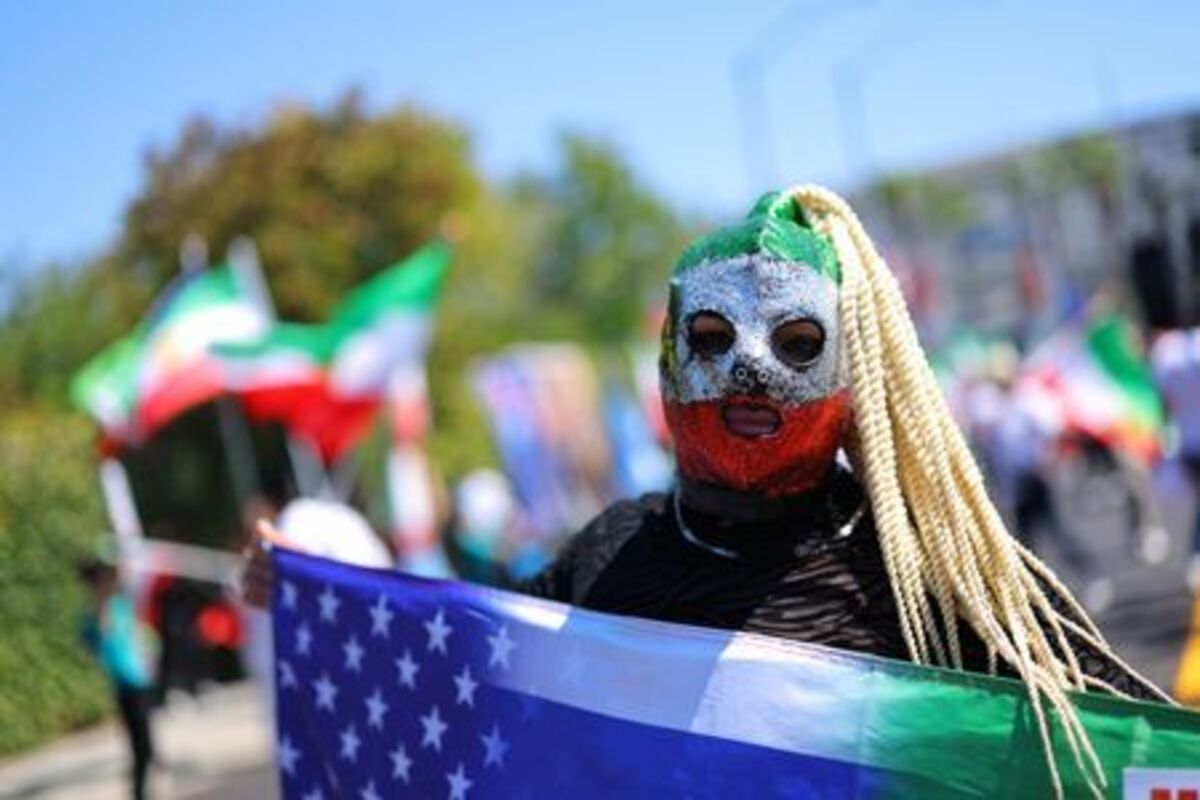 Soccer Football - FIFA World Cup 2026 - Group G - Iran v New Zealand - Los Angeles Stadium, Inglewood, California, U.S. - June 15, 2026 A protester wears an Iran themed mask outside the stadium REUTERS/Mike Blake