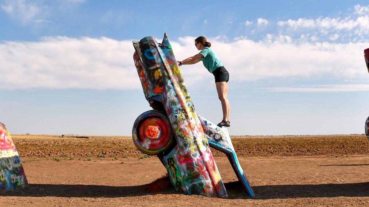 Cadillac Ranch, an artwork made from 10 old cars by the Ant Farm artists' collective in the 1970s, has become one of Amarillo, Texas' top attractions. Visitors are invited to add their own spray-painted touches. (Christopher Reynolds/Los Angeles Times/TNS)