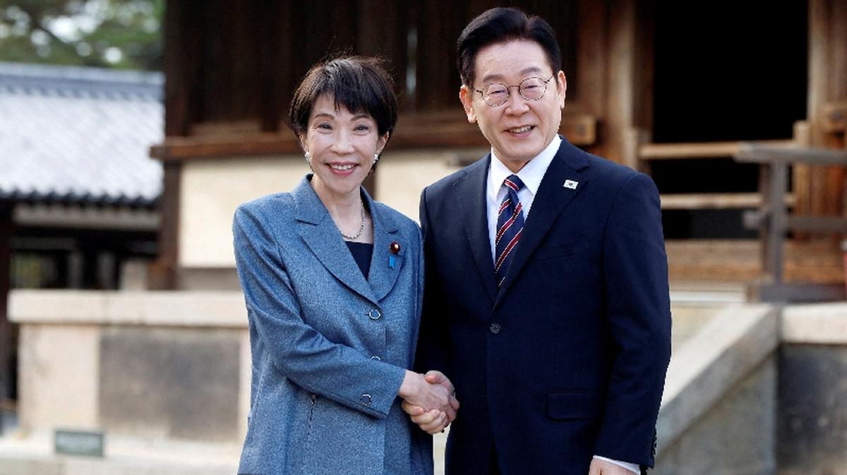 FILE PHOTO: Japanese Prime Minister Sanae Takaichi and South Korean President Lee Jae Myung pose for photographs as they visit the Western Precinct (Saiin Garan) at Horyu-ji temple in Ikaruga, Nara prefecture, Japan, January 14, 2026. FRANCK ROBICHON/Pool via REUTERS/File Photo