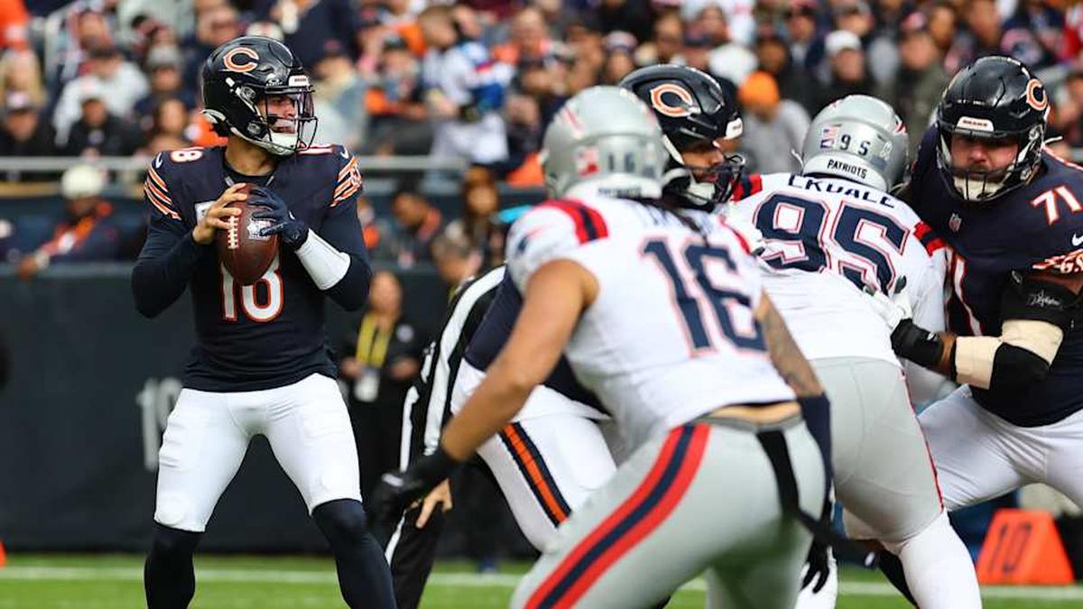  Nov 10, 2024; Chicago, Illinois, USA; Chicago Bears quarterback Caleb Williams (18) drops back to pass against the New England Patriots during the first quarter at Soldier Field. Mandatory Credit: Mike Dinovo-Imagn Images | Mike Dinovo-Imagn Images 