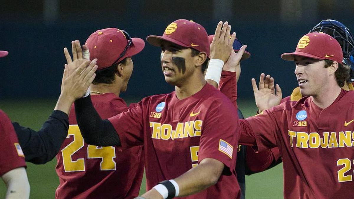  May 31, 2025; Corvallis, OR, USA; USC pitcher Caden Hunter (22) high-fives teammates after a game against Saint Mary's at the NCAA Corvallis Regional at Goss Stadium. Mandatory Credit: Troy Wayrynen-Imagn Images | Troy Wayrynen-Imagn Images 