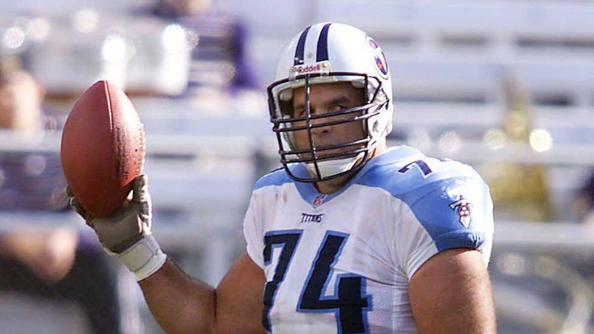  Tennessee Titans guard Bruce Matthews (74) receives the game ball after the first play of the game against the Baltimore Ravens in commemorating his 260th game, a new NFL record for an offensive lineman. But the visiting Titans lost the game 41-14 Dec. 5, 1999. Tennessee Titans At Baltimore Ravens Football | George Walker IV / The Tennessean, Nashville Tennessean via Imagn Content Services, LLC 