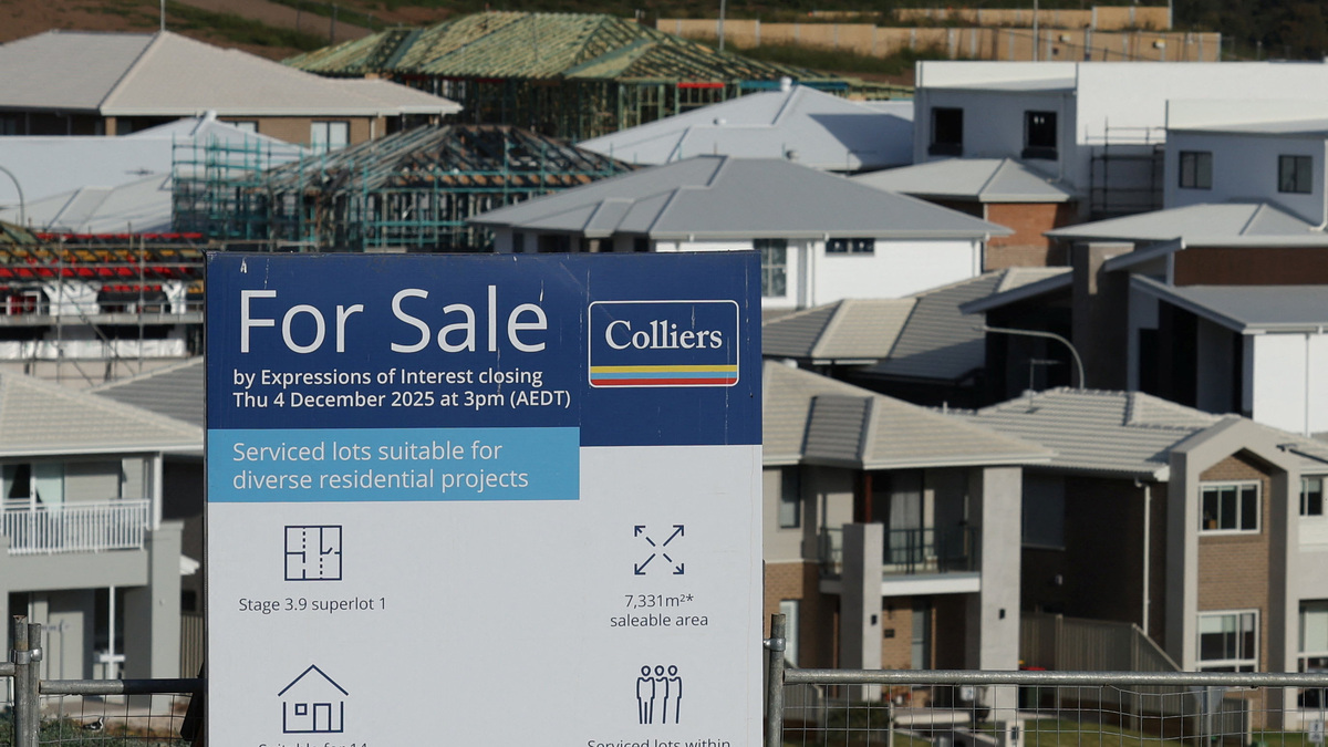 A 'For Sale' sign stands in front of newly constructed and under-construction homes, in the suburb of Menangle Park, in Sydney, Australia, June 10, 2026. REUTERS/Hollie Adams