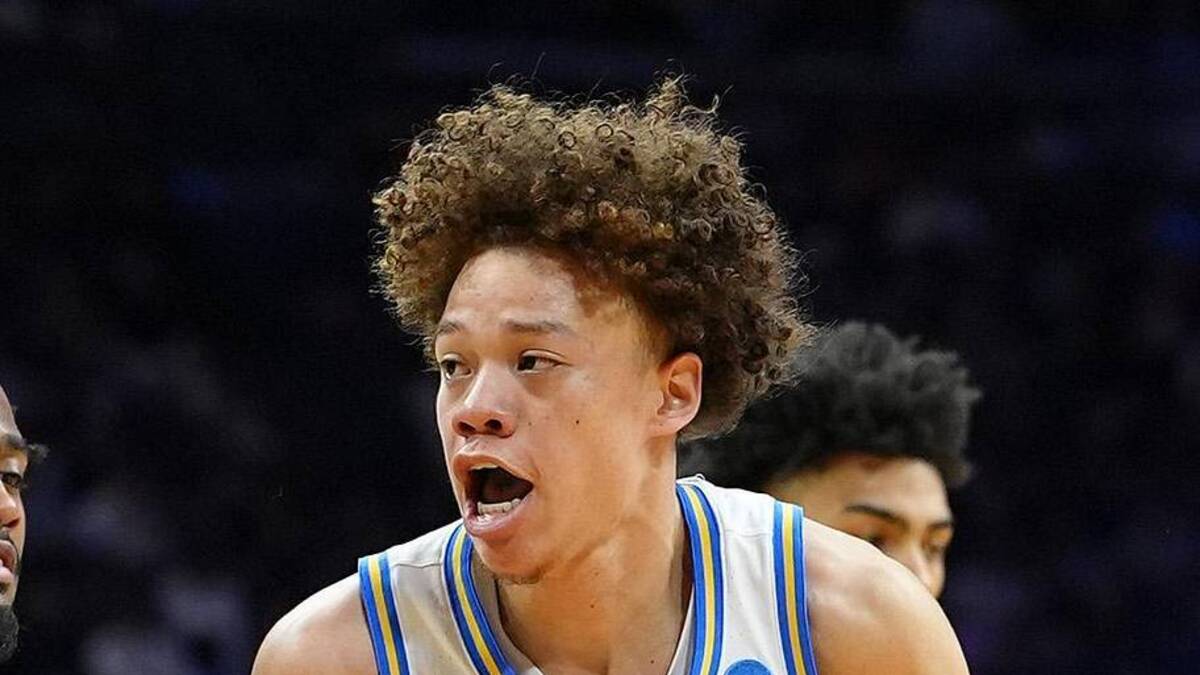  Mar 20, 2026; Philadelphia, PA, USA; UCLA Bruins guard Trent Perry (0) dribbles the ball against UCF Knights guard Themus Fulks (1) in the first half during a first round game of the men's 2026 NCAA Tournament at Xfinity Mobile Arena. Mandatory Credit: Kyle Ross-Imagn Images | Kyle Ross-Imagn Images 