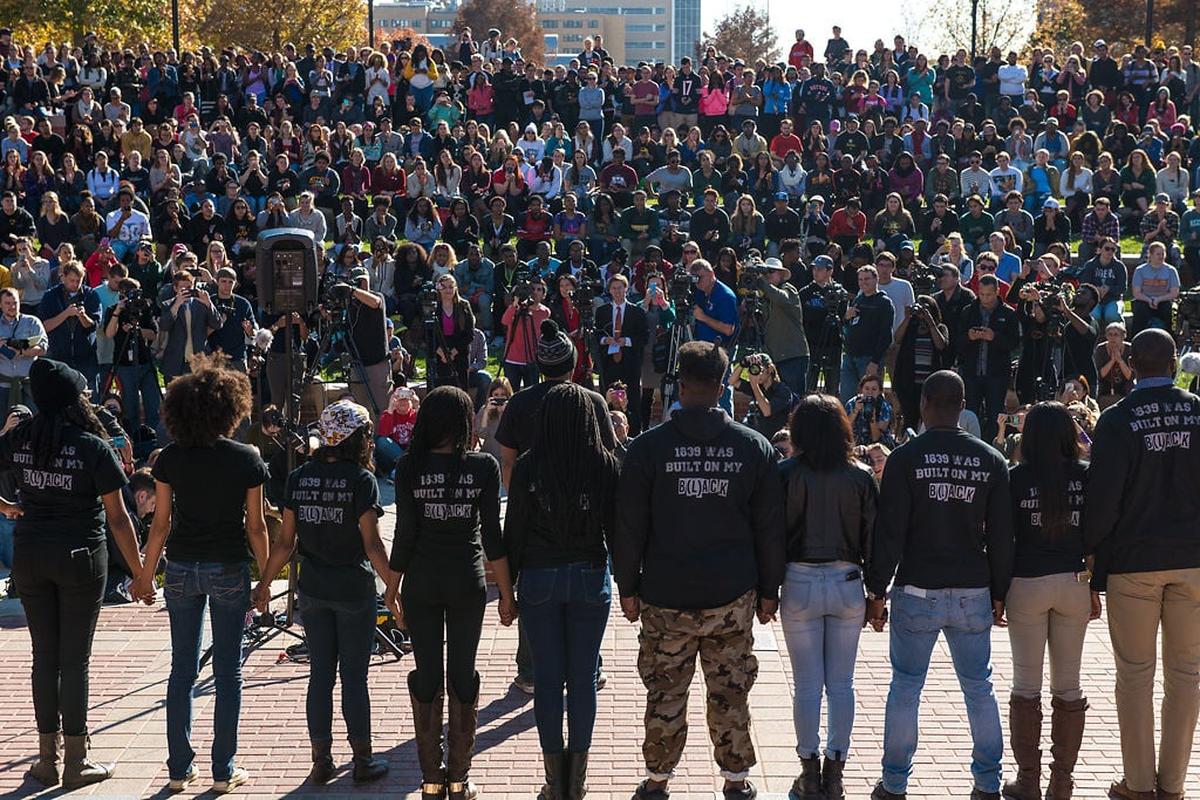 The original 11 members of Concerned Student 1950 hold a news conference on Nov. 9, 2015, at Traditions Plaza after the resignation of UM System President Tim Wolfe. The group remained distrustful of the influx of local and national reporters, putting up signs around the camp telling reporters and those not involved to stay away.