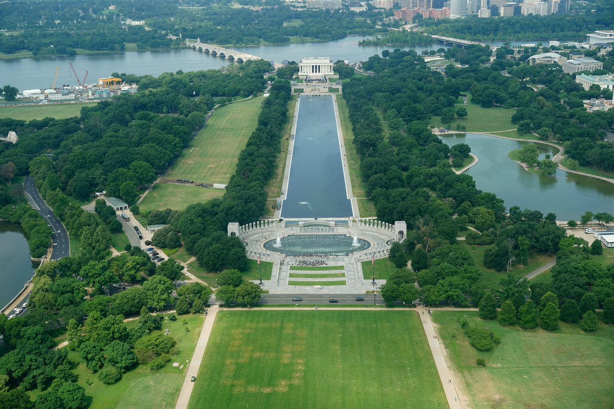 Authorities responded to what appeared to be a large tracing of the term 8647 into the grounds of the National Mall in Washington, D.C., June 11, 2026. A Reuters photographer captured the emerging image from atop the Washington Monument on the Mall's grass shortly before authorities arrived. The arrangement of the numbers was clearly an attempt to show 8647, though the 4 was not fully formed. Federal prosecutors on other occasions have said the term could indicate a threat to President Trump, the 47th U.S. president. REUTERS/ Nathan Howard