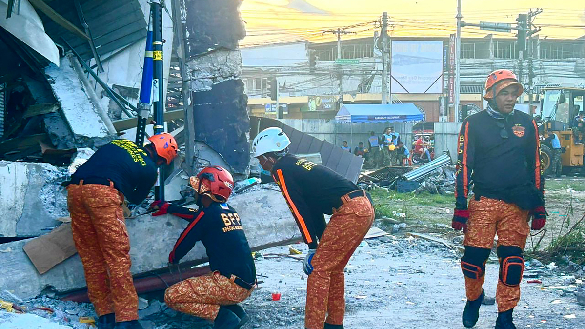 Responders conduct a rescue operation at a collapsed building after a 7.8 magnitude earthquake in General Santos City on June 8, 2026. A 7.8-magnitude earthquake struck the southern Philippines on June 8, killing at least 15 people, collapsing buildings and sparking tsunami warnings across the region.(Ferdinandh Cabrera/AFP/Getty Images/TNS)