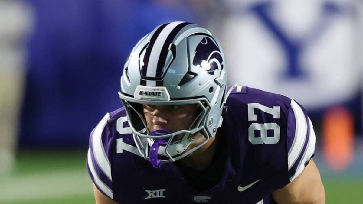  Sep 21, 2024; Provo, Utah, USA; Kansas State Wildcats tight end Brayden Loftin (87) runs after a catch and is tackled by Brigham Young Cougars safety Crew Wakley (7) during the first quarter at LaVell Edwards Stadium. Mandatory Credit: Rob Gray-Imagn Images | USA TODAY Sports via Reuters Connect 