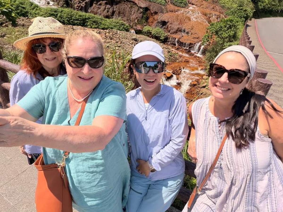  Tour group with Jennifer You, our tour guide, at the Golden Waterfall. Photo credit: Marguerite "Peggy" Cleveland 