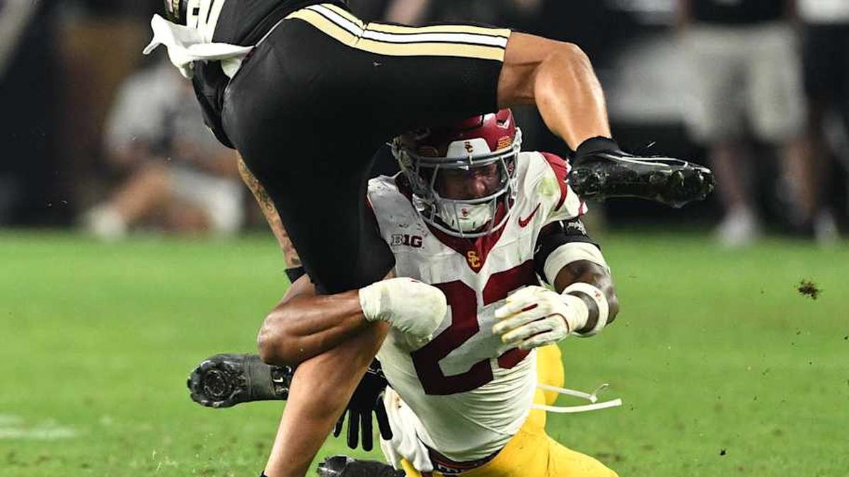  Sep 13, 2025; West Lafayette, Indiana, USA; Purdue Boilermakers wide receiver Michael Jackson III (2) is tackled by USC Trojans linebacker Desman Stephens II (23) during the second half at Ross-Ade Stadium. Mandatory Credit: Marc Lebryk-Imagn Images | Marc Lebryk-Imagn Images 