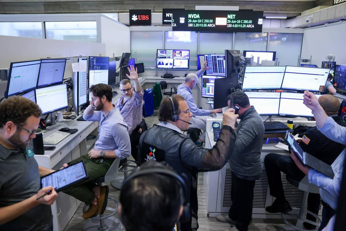  Goldman Sachs and JPMorgan are running internal programs to reduce settlement times and automate compliance checks at scale. Nagle/Getty Images