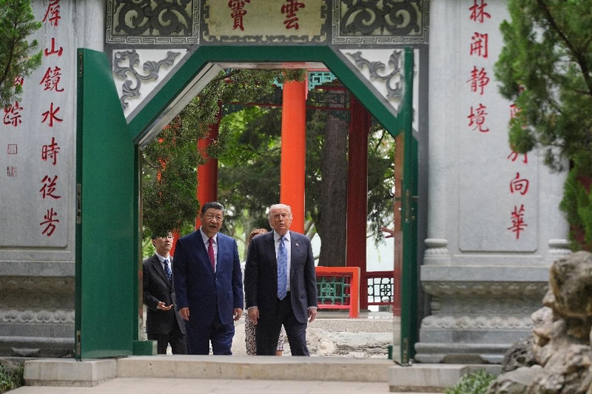 President Donald Trump talks with China’s President Xi Jinping at the Zhongnanhai leadership compound, Friday, May 15, 2026, in Beijing.  Mark Schiefelbein/Pool via REUTERS