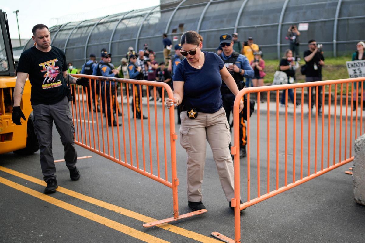 New Jersey State Policemen secure the area near the Delaney Hall detention center, as demonstrators remain gathered outside, in Newark, New Jersey, U.S., May 29, 2026. REUTERS/Eduardo Munoz