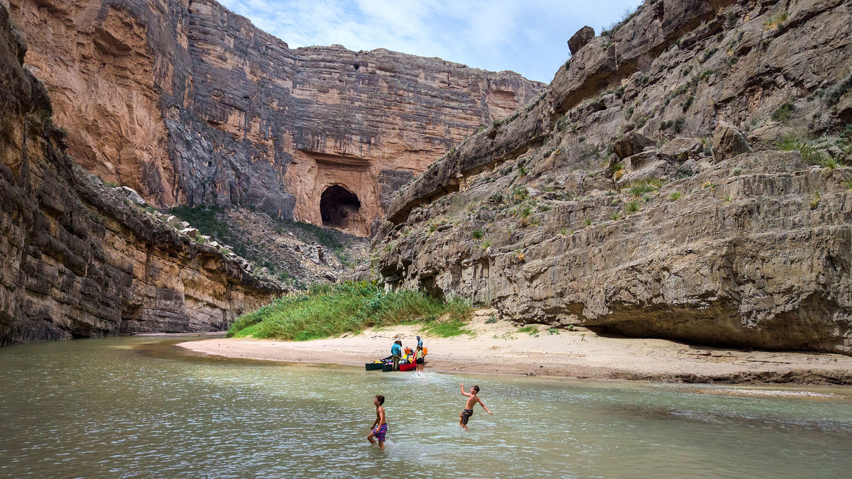In an aerial view, a family stops for swimming in the Rio Grande during a guided canoe trip through the Santa Elena Canon on April 11, 2026, in Big Bend National Park, Texas. (John Moore/Getty Images/TNS)