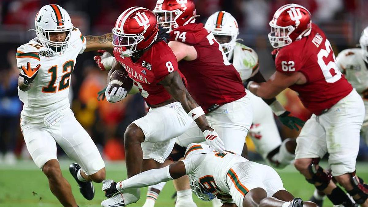  Jan 19, 2026; Miami Gardens, FL, USA; Indiana Hoosiers running back Kaelon Black (8) rushes the ball Miami Hurricanes in the first half during the College Football Playoff National Championship game at Hard Rock Stadium. Mandatory Credit: Mark J. Rebilas-Imagn Images | Mark J. Rebilas-Imagn Images 