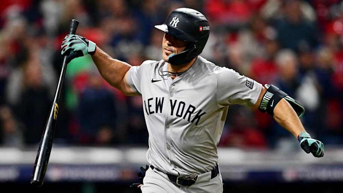  New York Yankees designated hitter Giancarlo Stanton (27) celebrates after hitting a two run home run during the sixth inning against the Cleveland Guardians during game five of the ALCS for the 2024 MLB playoffs at Progressive Field. | David Dermer-Imagn Images 