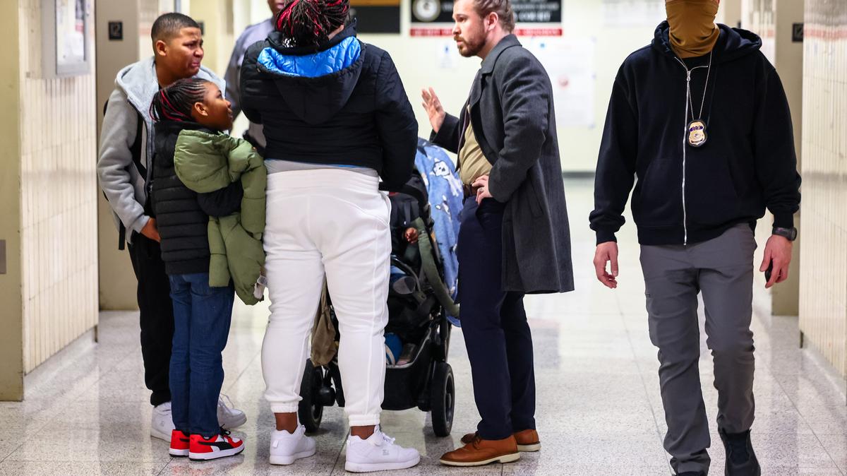 DHS Agents Patrol Immigration Court In New York City. A federal agent walks past a family whose asylum case was dismissed in halls of immigration court at the Jacob K. Javits Federal Building on March 05, 2026 in New York City. 