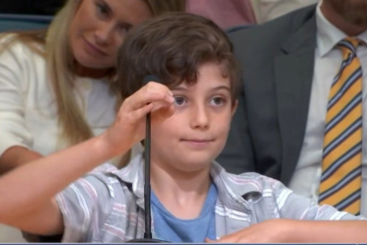 Ten-year-old Wesley Pike tells county commissioners that the K-12 Christian school proposed for Jupiter Farms would be out of chracter for the rural area