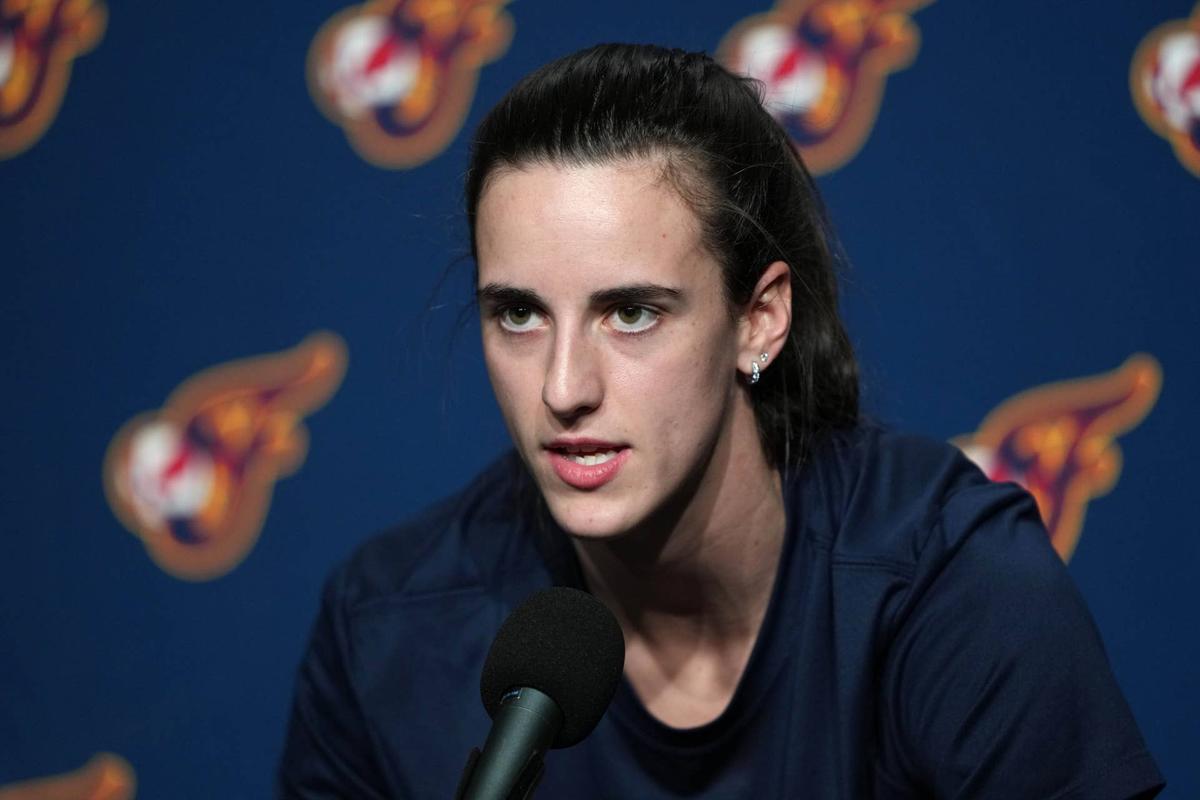  Indiana Fever guard Caitlin Clark (22) talks to media members before a game. Darren Yamashita-Imagn Images