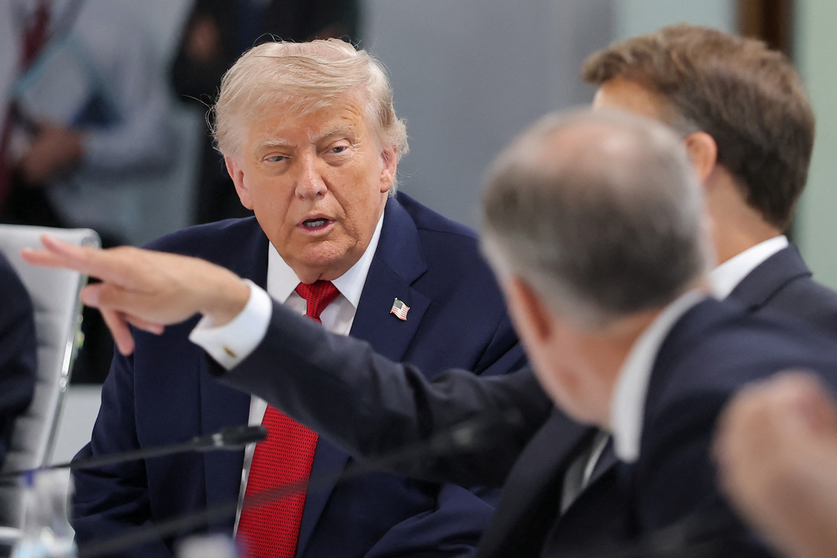 U.S. President Donald Trump looks on as he arrives for a working session with G7 leaders and outreach partners on promoting economic growth, during the G7 Summit in Evian-les-Bains, France, June 17, 2026. REUTERS/Christian Hartmann