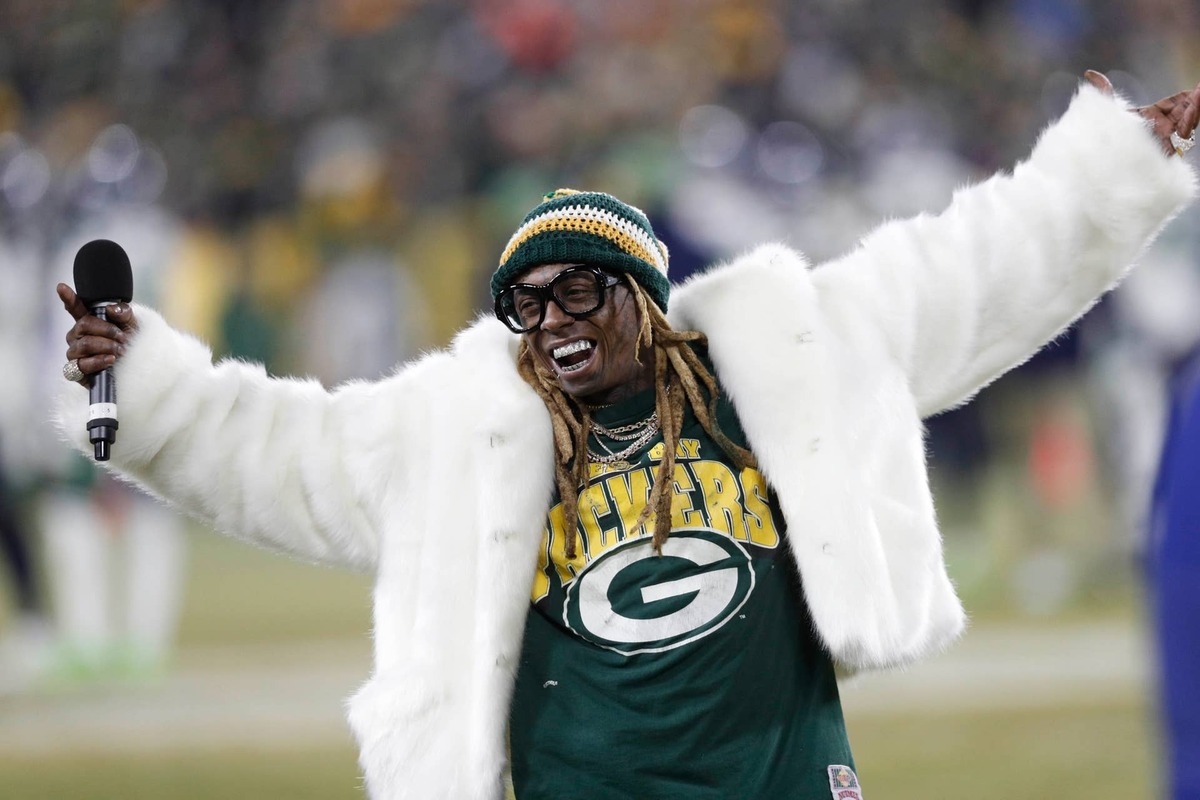  Recording artist Lil Wayne addresses the crowd in the second half of the NFC Divisional Round game between the Green Bay Packers and Seattle Seahawks at Lambeau Field. Jeff Hanisch-USA TODAY Sports