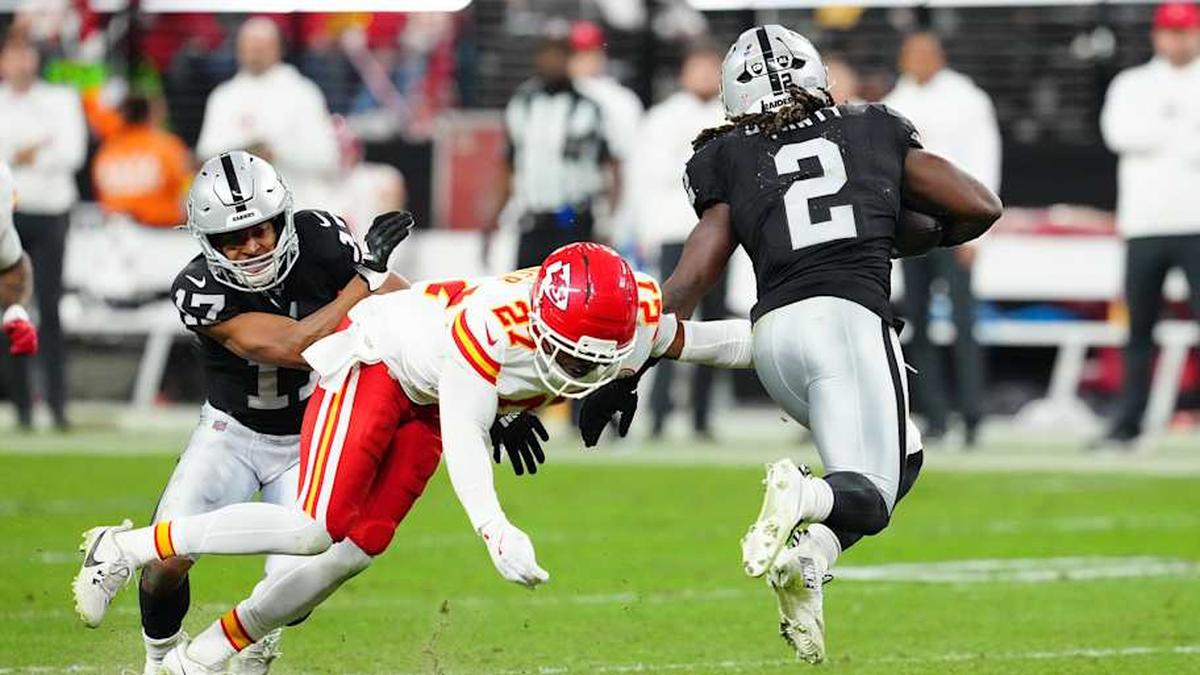  Jan 4, 2026; Paradise, Nevada, USA; Kansas City Chiefs safety Chamarri Conner (27) misses a tackle attempt against Las Vegas Raiders running back Ashton Jeanty (2) during the fourth quarter at Allegiant Stadium. Mandatory Credit: Stephen R. Sylvanie-Imagn Images | Stephen R. Sylvanie-Imagn Images 