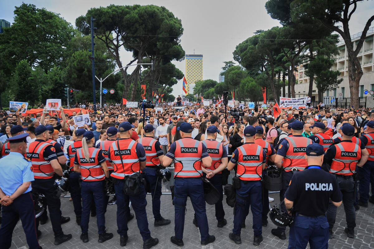  Police officers block a street during a demonstration in Tirana, Albania, on Wednesday, June 3, 2026, opposing a luxury coastal development project linked to Jared Kushner and Ivanka Trump over concerns about environmental impacts and transparency. (AP Photo/Hameraldi Agolli) 