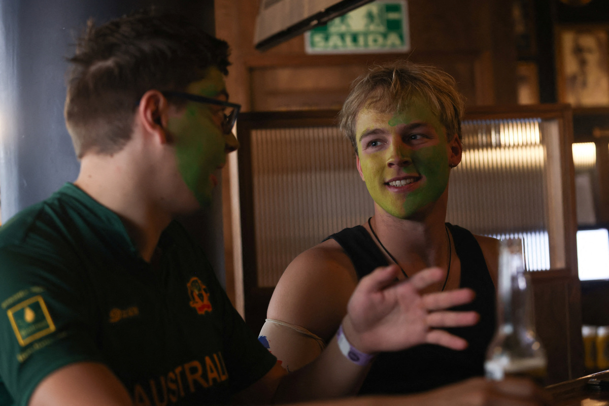 Two men talk while watching a FIFA World Cup 2026 match at the Duke of Lisbon pub, a British-Mexican bar, that expects to see fans gather to watch the match between Mexico and England in the World Cup Round of 16, in Mexico City, Mexico, July 3, 2026. REUTERS/Quetzalli Nicte-Ha