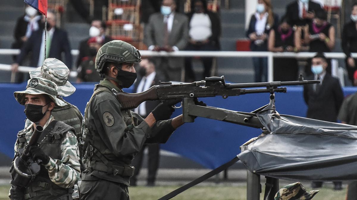 Members of Venezuela’s army aboard a tank during a military parade marking the 210th anniversary of the independence of Venezuela on July 5, 2021, in Caracas, Venezuela. Caracas was recently named the riskiest city in the world to visit by Forbes Advisor. (Carolina Cabral/Getty Images/TNS)
