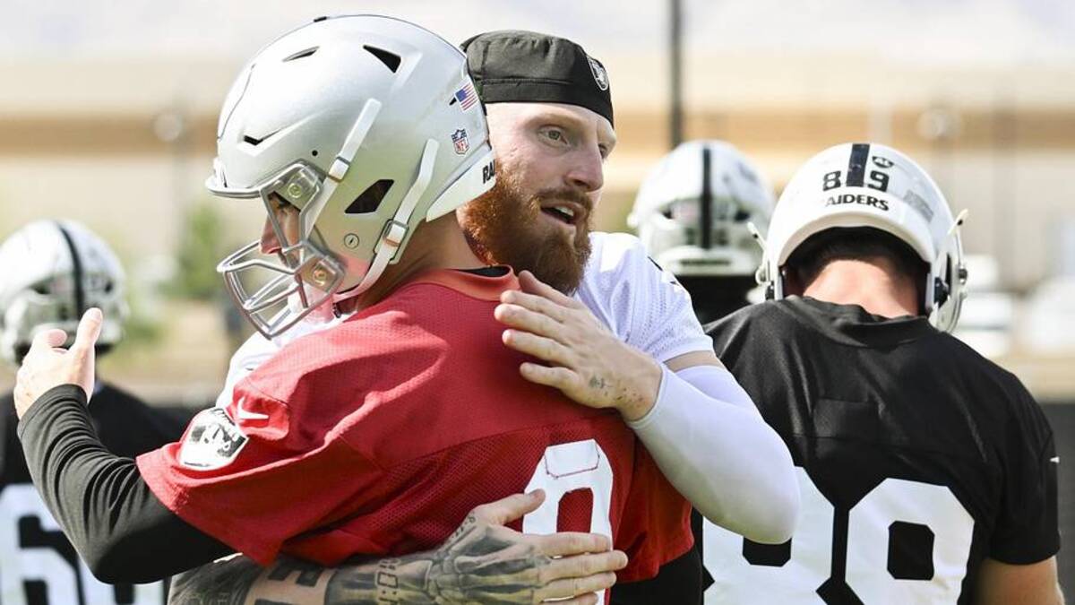  Jun 3, 2026; Henderson, NV, USA; Las Vegas Raiders defensive end Maxx Crosby (98) hugs quarterback Kirk Cousins (8) during organized team activities at Intermountain Health Performance Center. Mandatory Credit: Candice Ward-Imagn Images | Candice Ward-Imagn Images 