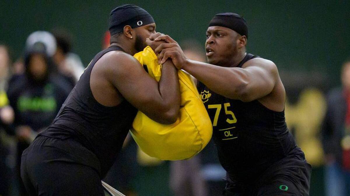  Oregon offensive lineman Emmanuel Pregnon, right, hits offensive lineman Matthew Bedford during Oregon Pro Day on March 17, 2026, at the Moshofsky Center in Eugene, Oregon. | Ben Lonergan/The Register-Guard / USA TODAY NETWORK via Imagn Images 