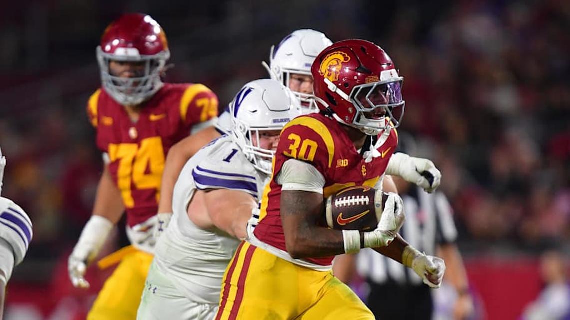  Nov 7, 2025; Los Angeles, California, USA; Southern California Trojans running back King Miller (30) runs the ball against the Northwestern Wildcats during the second half at the Los Angeles Memorial Coliseum. Mandatory Credit: Gary A. Vasquez-Imagn Images | Gary A. Vasquez-Imagn Images 
